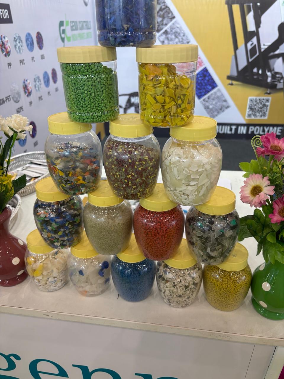 Display of recycled plastic flakes and granules across polymer grades